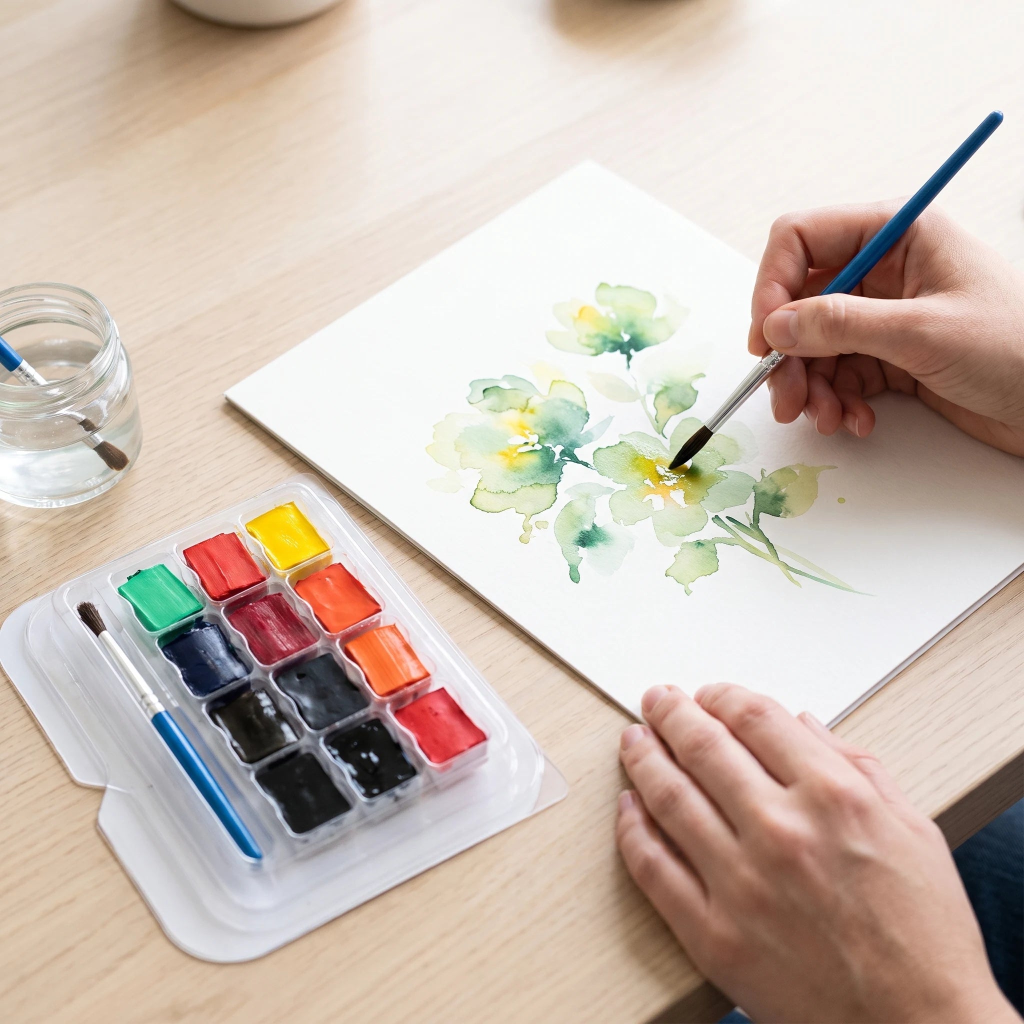 Malen mit Aquarellfarben in halben Näpfchen
